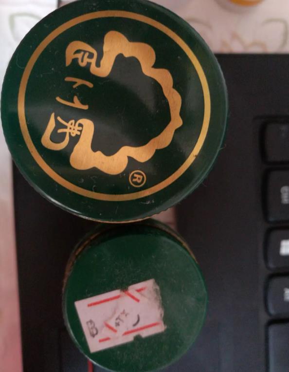泰国真假卧佛牌青草膏对比的图片 第1张 泰国真假卧佛牌青草膏对比